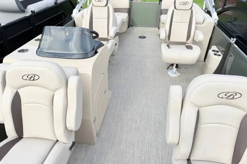 Slide: The Image of 2027 Bentley Pontoons Fish 220 FWD CW interior with luxurious seating and helm. - 4