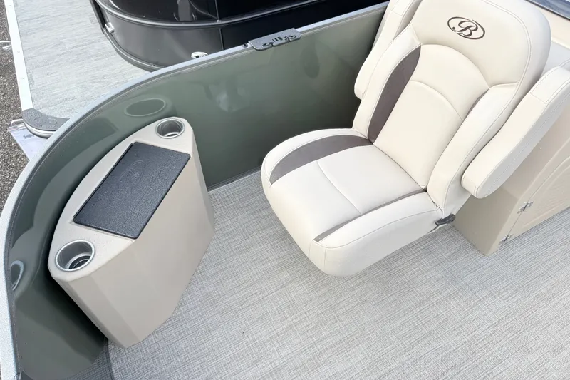 Slide: The Image of 2027 Bentley Pontoons Fish 220 FWD CW interior with beige seating and cup holders. - 5