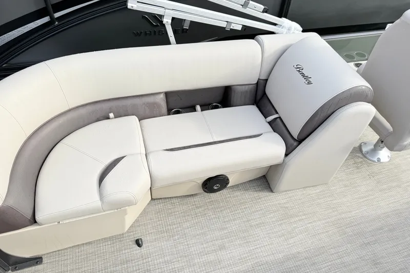 Slide: The Image of 2027 Bentley Pontoons Fish 220 FWD CW boat seating with beige and gray upholstery. - 12