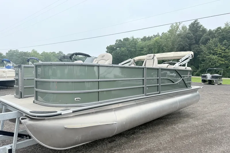 Slide: The Image of 2027 Bentley Pontoons Fish 220 FWD CW on trailer, parked outdoors. - 1