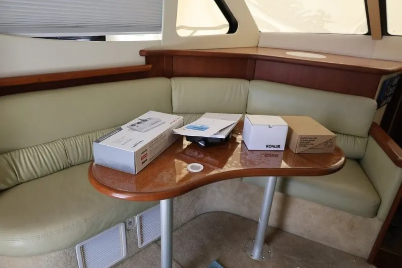 Slide: The Image of Interior of 2005 Silverton 34 Convertible with boxes on a wooden table. - 12