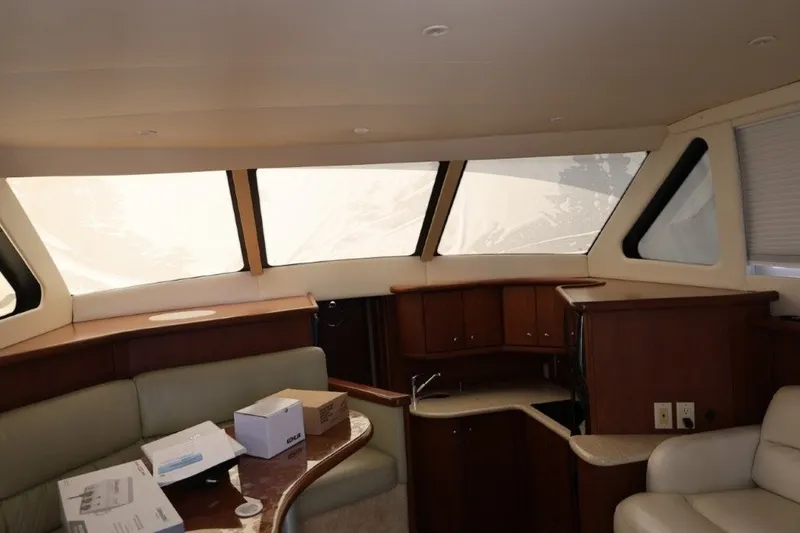 Slide: The Image of Interior of a 2005 Silverton 34 Convertible yacht with seating and cabinetry. - 10