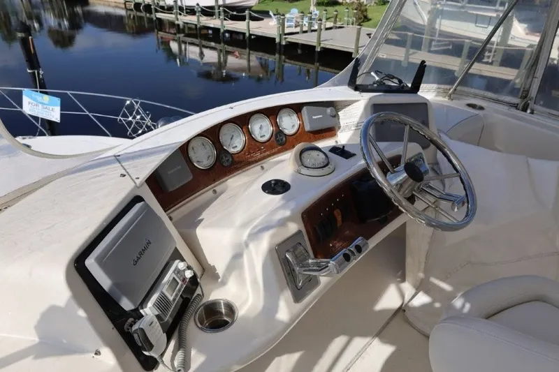 Slide: The Image of Helm of 2005 Silverton 34 Convertible boat with steering wheel and navigation instruments. - 16