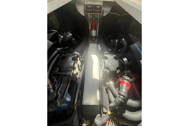 Slide: The Image of Engine compartment of a 1989 Sea Ray 300 Weekender boat, showcasing mechanical components. - 31