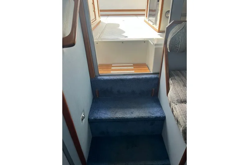 Slide: The Image of Interior stairs of 1989 Sea Ray 300 Weekender boat, leading to deck area. - 26