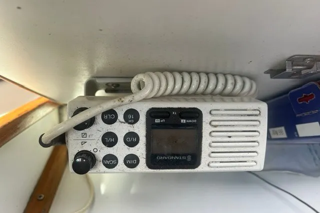 Slide: The Image of Marine radio equipment inside a 1989 Sea Ray 300 Weekender boat. - 13