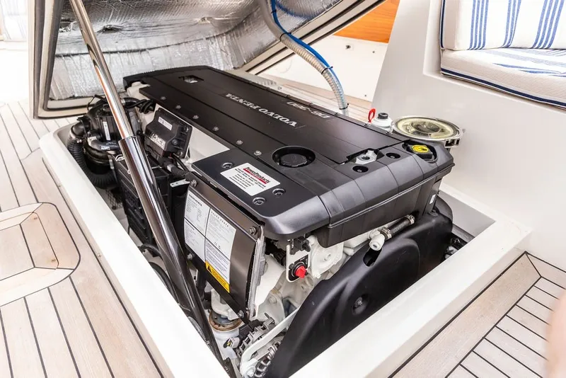 Slide: The Image of Engine compartment of 2025 Hinckley Yachts Talaria 29 Runabout, showcasing Volvo Penta engine. - 24