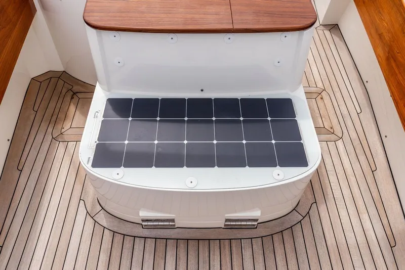 Slide: The Image of Hinckley Yachts Talaria 29 Runabout 2025 interior with solar panel and teak flooring. - 23