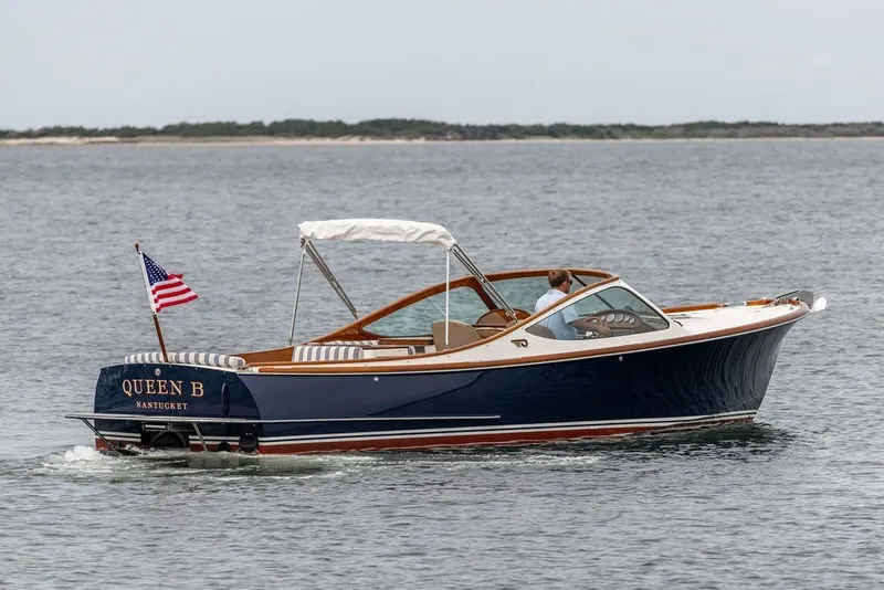 Slide: The Image of 2025 Hinckley Yachts Talaria 29 Runabout cruising on calm waters. - 31