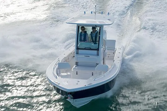 Slide: The Image of Manufacturer Provided Image: 2020 Everglades 253 Center Console boat cruising on water. - 3