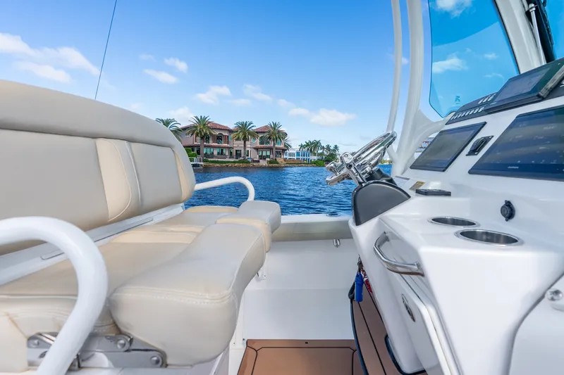 Slide: The Image of Interior view of 2020 Everglades 253 Center Console boat on a sunny day. - 24