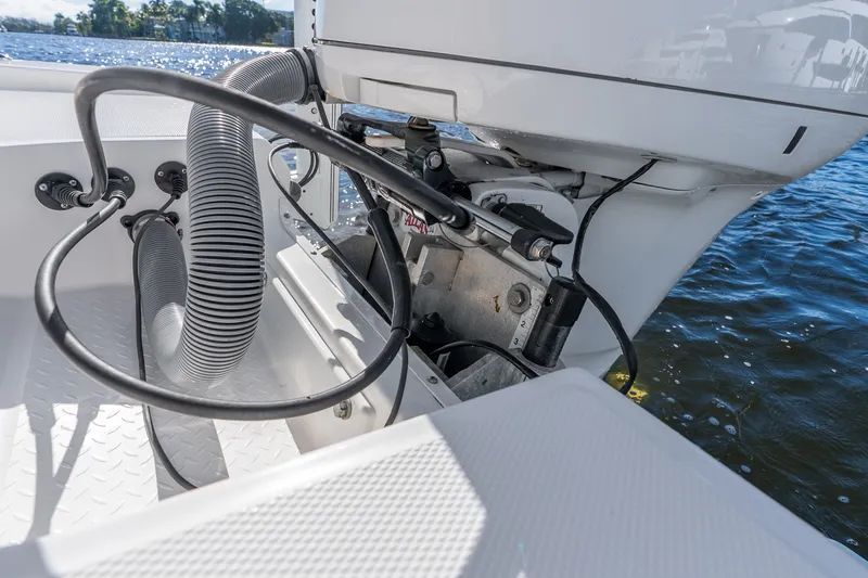 Slide: The Image of 2020 Everglades 253 Center Console boat engine detail on water. - 47