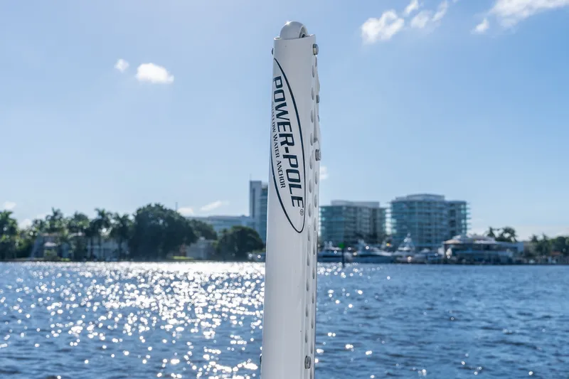 Slide: The Image of Power-Pole anchor on Everglades 253 Center Console boat, 2020, with waterfront cityscape. - 49