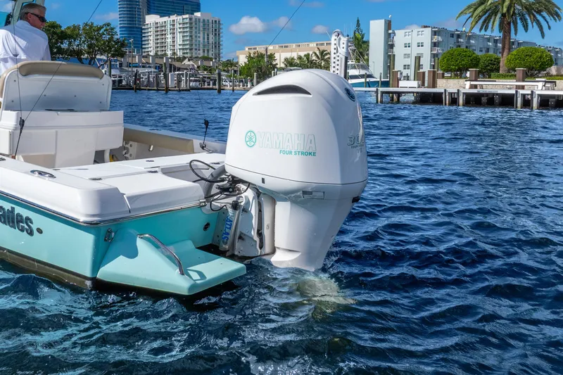 Slide: The Image of 2020 Everglades 253 Center Console boat with Yamaha outboard engine on water. - 15