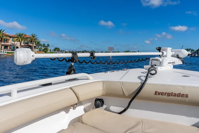 Slide: The Image of 2020 Everglades 253 Center Console boat on water with Minn Kota trolling motor. - 35