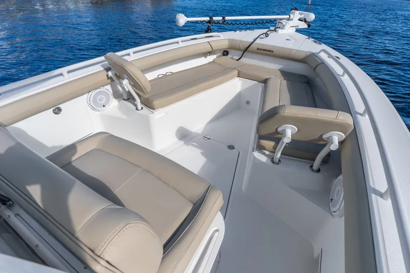 Slide: The Image of 2020 Everglades 253 Center Console boat interior with beige seating on blue water. - 29