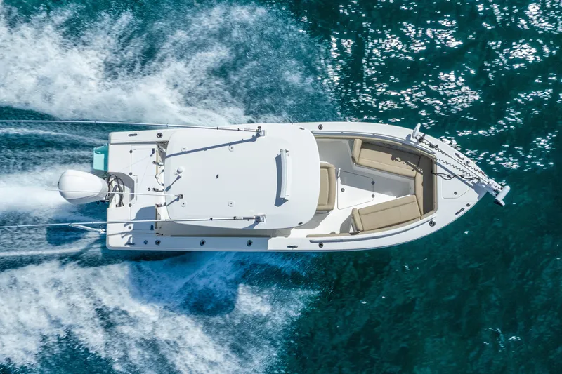 Slide: The Image of Aerial view of 2020 Everglades 253 Center Console boat cruising on clear blue water. - 14