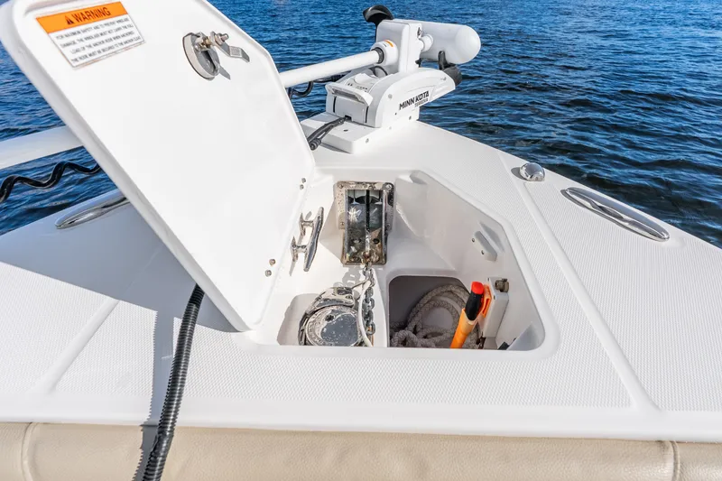 Slide: The Image of Open anchor compartment on 2020 Everglades 253 Center Console boat, with Minn Kota trolling motor. - 37