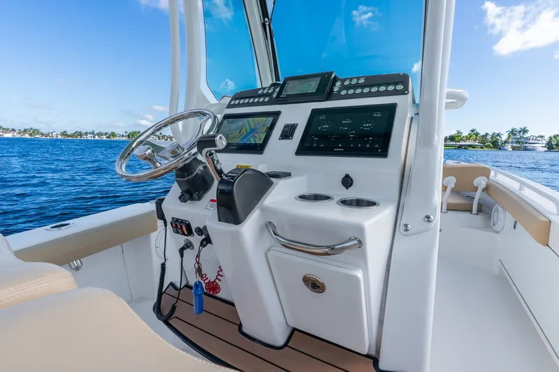Slide: The Image of 2020 Everglades 253 Center Console boat interior with advanced navigation system. - 22