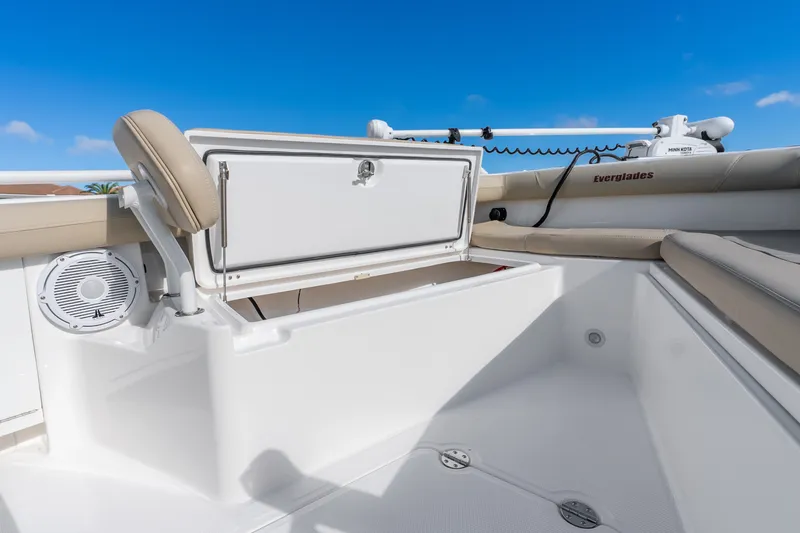 Slide: The Image of 2020 Everglades 253 Center Console boat interior with storage compartment open. - 33