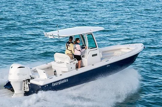 Slide: The Image of Manufacturer Provided Image: 2020 Everglades 253 Center Console boat cruising on the ocean. - 2