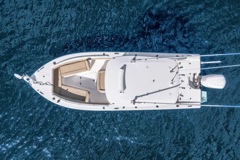Slide: The Image of Overhead view of 2020 Everglades 253 Center Console boat on blue water. - 17