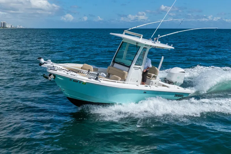Slide: The Image of 2020 Everglades 253 Center Console boat cruising on open ocean waters. - 20