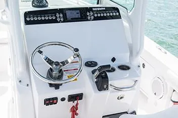 Slide: The Image of Manufacturer Provided Image: 2020 Everglades 253 Center Console boat dashboard with steering wheel and controls. - 9