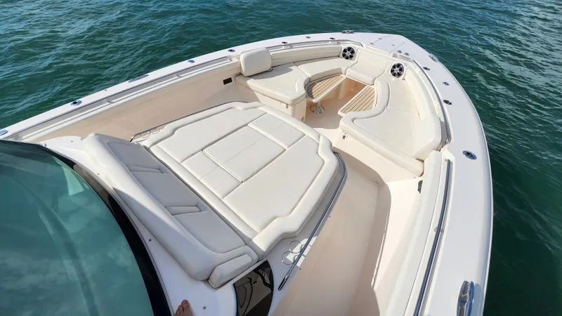 Slide: The Image of The image shows the bow of a Grady-White Canyon 456 boat with comfortable seating. - 16