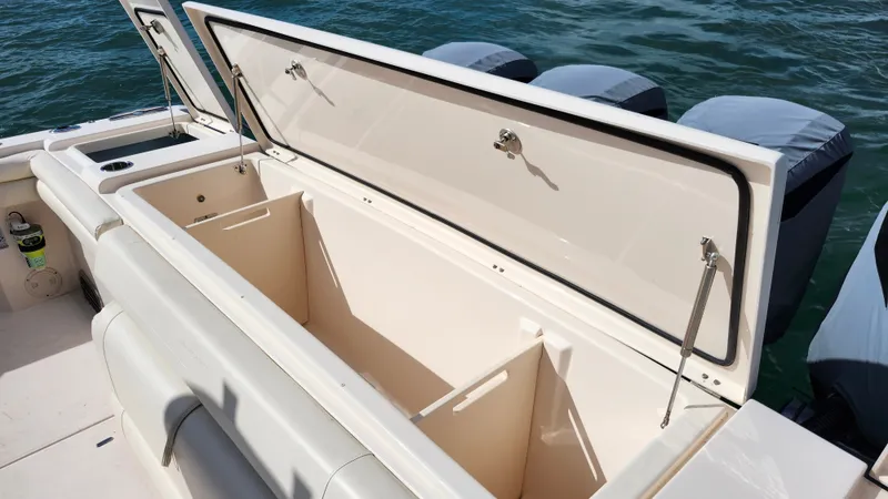 Slide: The Image of The image shows the storage compartment of a 2022 Grady-White Canyon 456 boat. - 30