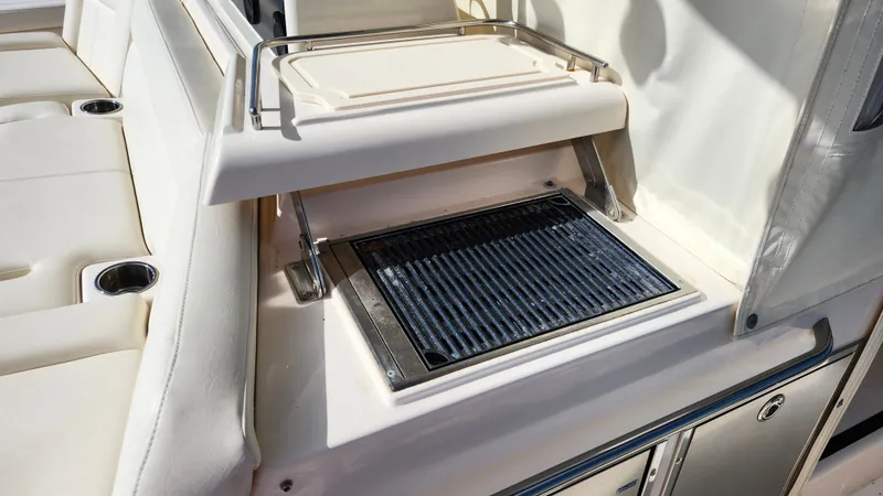 Slide: The Image of A grill on a 2022 Grady-White Canyon 456 boat. - 25