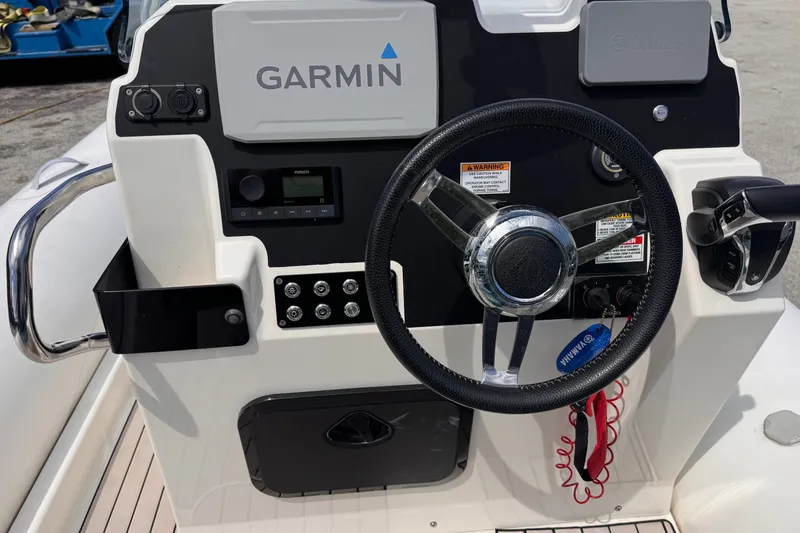 Slide: The Image of Control panel of 2022 Zodiac Medline 6.8 boat with Garmin navigation system. - 9