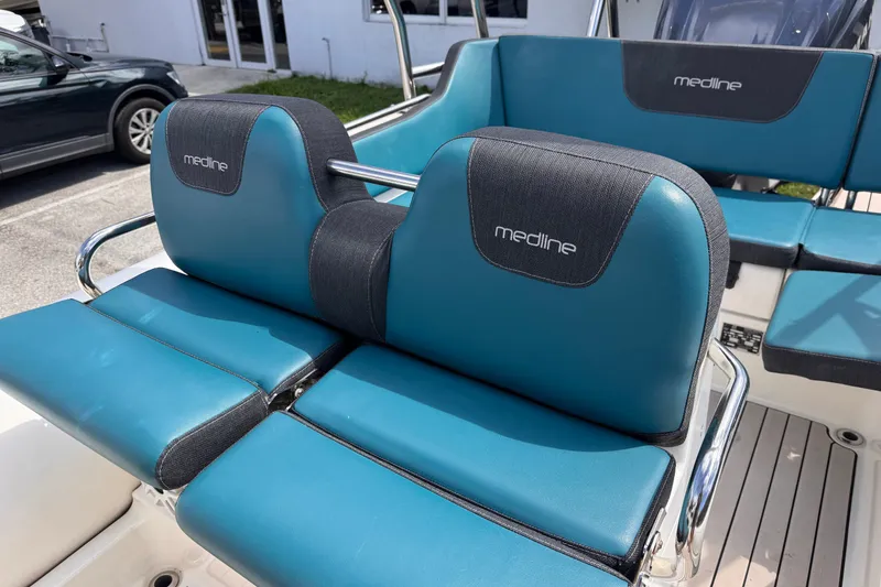 Slide: The Image of 2022 Zodiac Medline 6.8 boat seats with blue and black upholstery. - 11