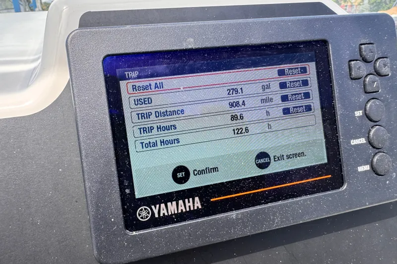 Slide: The Image of Yamaha display on Zodiac Medline 6.8 showing trip data: fuel, distance, and hours. - 14