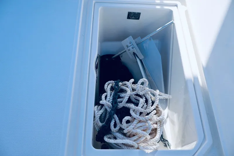 Slide: The Image of Storage compartment on 2010 Deep Impact 330 C boat with ropes and anchor. - 43