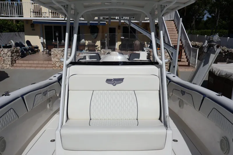 Slide: The Image of 2010 Deep Impact 330 C boat interior with white seating and elegant design. - 39