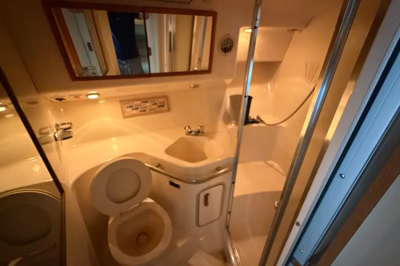 Slide: The Image of Bathroom interior of a 1993 Sea Ray 400 Express Cruiser yacht. - 17