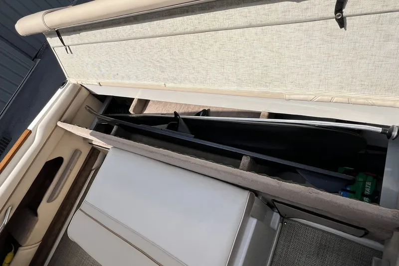 Slide: The Image of Interior storage compartment of a 1997 Sea Ray 240 Overnighter boat. - 96