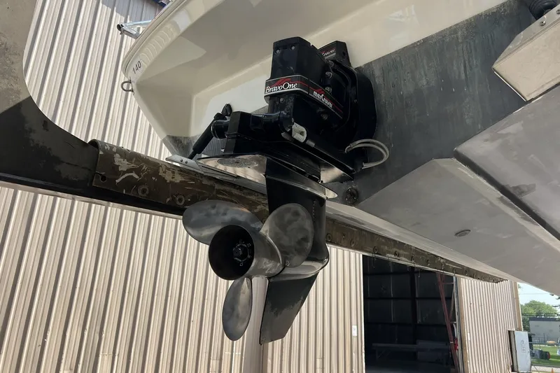 Slide: The Image of 1997 Sea Ray 240 Overnighter boat with MerCruiser Bravo One outdrive and propeller. - 89