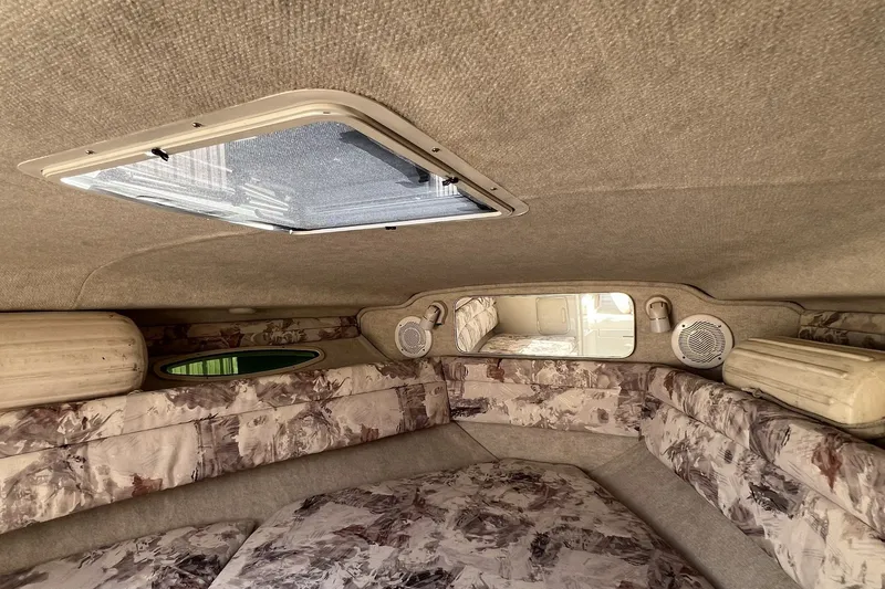 Slide: The Image of Interior cabin of a 1997 Sea Ray 240 Overnighter boat with patterned upholstery. - 54