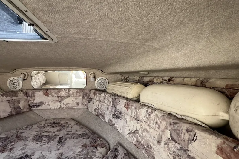 Slide: The Image of Interior cabin of a 1997 Sea Ray 240 Overnighter boat with patterned upholstery. - 55