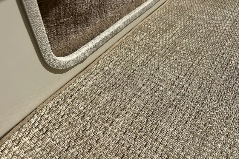Slide: The Image of Close-up of textured flooring and trim on a 1997 Sea Ray 240 Overnighter boat. - 22