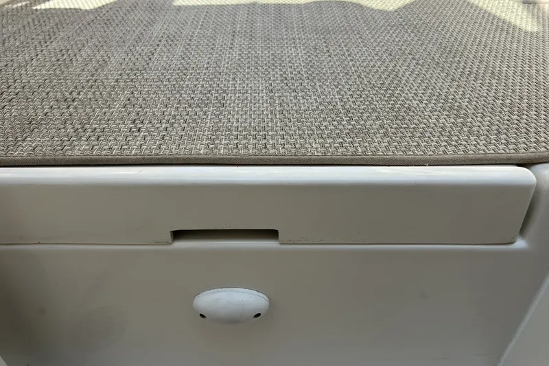 Slide: The Image of 1997 Sea Ray 240 Overnighter boat interior with textured upholstery detail. - 64