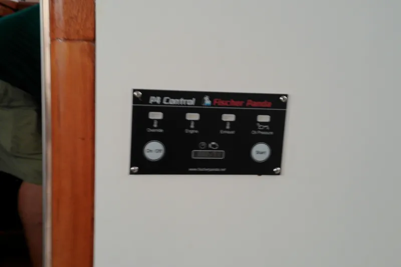 Slide: The Image of Control panel on a 2005 Mariner 34 Orient boat, featuring Fischer Panda system. - 29