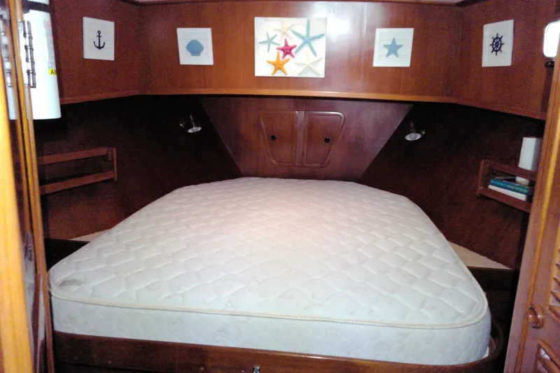 Slide: The Image of Cozy cabin interior of 2005 Mariner 34 Orient yacht with nautical decor and comfortable bed. - 20