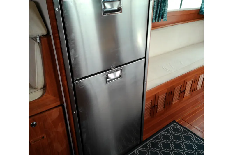 Slide: The Image of Stainless steel fridge in 2005 Mariner 34 Orient yacht interior with wooden accents. - 25