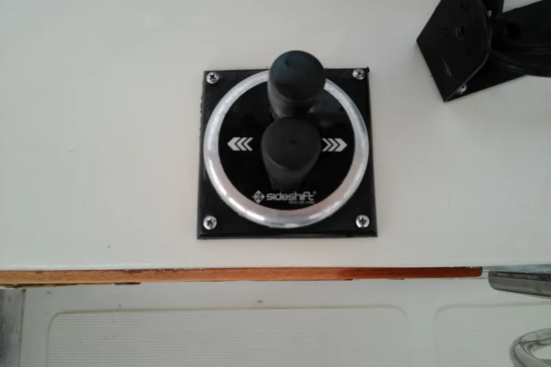Slide: The Image of Control panel of a 2005 Mariner 34 Orient boat with SideShift thruster controls. - 38