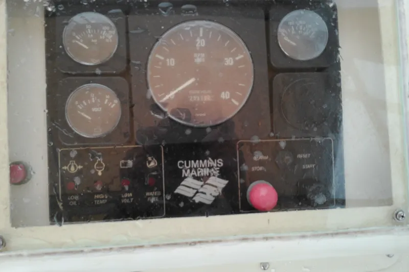 Slide: The Image of Instrument panel of a 2005 Mariner 34 Orient boat with Cummins Marine gauges. - 36
