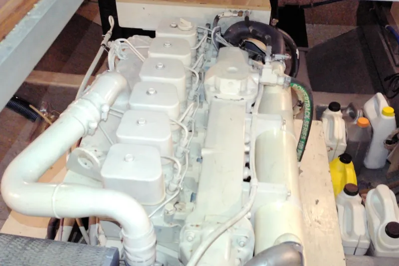 Slide: The Image of Engine compartment of a 2005 Mariner 34 Orient boat, featuring various mechanical components. - 33