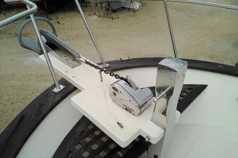 Slide: The Image of Anchor system on 2005 Mariner 34 Orient boat deck, featuring chain and winch. - 12